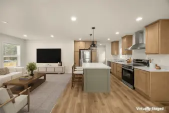 Virtually staged perspective showing living and kitchen spaces with front entry and dining room behind