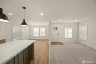 Seamless flow between living, dining, and kitchen spaces