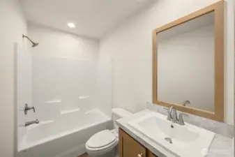 Hall bathroom conveniently located between the 2 secondary bedrooms