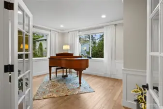 The main floor den is super versatile--  a closet and adjacent 3/4 bath make this a functional 4th bedroom