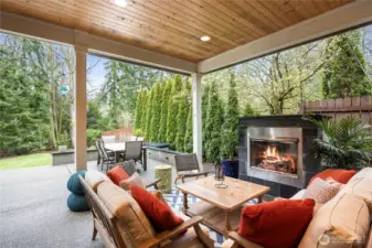 The covered patio with fireplace provides a year-'round, cozy outdoor retreat