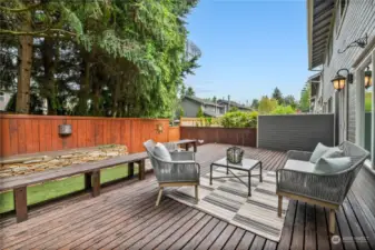 Relax and unwind on this charming backyard deck, featuring comfortable built-in seating. The home feels private and secluded in the backyard, offering the perfect outdoor retreat.