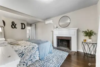 Main floor Primary bedroom with wood burning fireplace