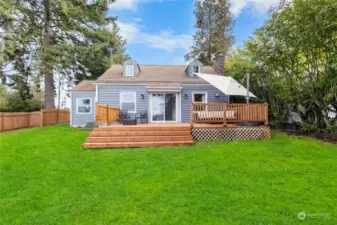 This beauty sits on a private, corner lot with views of the mountains and water