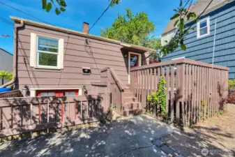 Back yard with deck and access to lower level