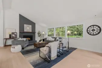 The living room features a vaulted ceiling and cozy gas fireplace.