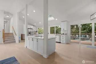 Gorgeous engineered hardwood floors create a timeless and elegant feel throughout the great room.