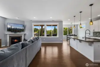 Open-concept main floor with gas fireplace.