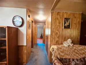 Hallway to 2 beds & bath