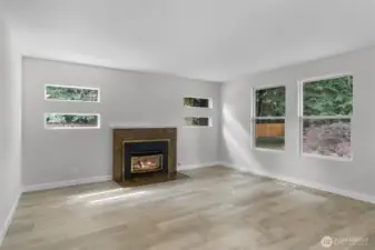 Extra windows allow for natural lighting to flood the home. Brick wrapped gas fireplace provides winter warmth and ambiance.