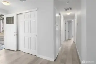 Hallway leads to three bedroom and full bathroom.