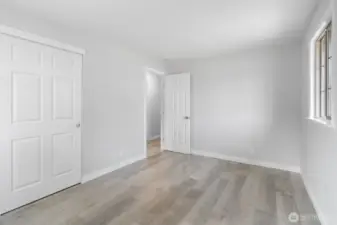 Another view of the Primary Bedroom showing the closet with new six panel door.