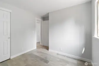 One of two guest bedrooms, each with multiple electrical outlets.