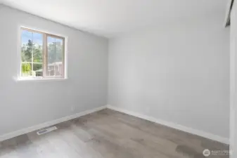 Another view of the first guest bedroom, with views into the front yard.