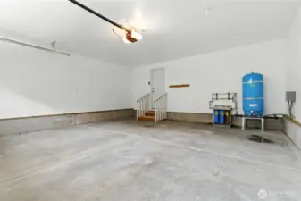 Large clean garage. Water filtration system in blue.