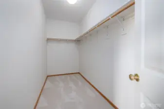 Spacious walk-in closet off primary suite.