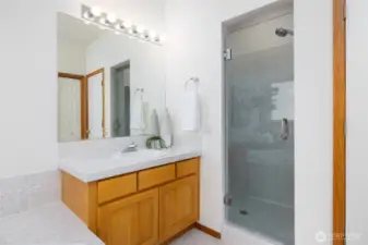 Walk-in tile shower in the primary bathroom