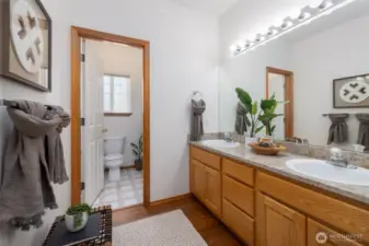 Second spacious bathroom with separate area for bath/shower