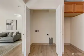 Washer and Dryer located in kitchen behind byfold doors