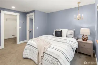 Upper-level 5th of 5 bedrooms with walk-in closet.