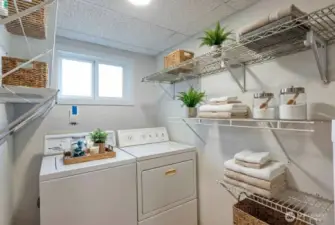 Laundry room comes with washer and dryer. Digitally staged