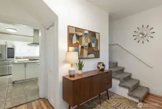 Hallway off kitchen - stairs to second floor. Digitally staged.