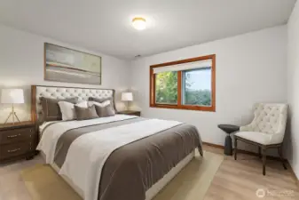 Lower level bedroom.  Virtually staged.