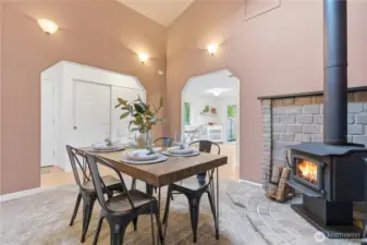 Formal dining room enjoys a cozy wood fireplace,