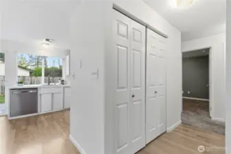 Hall closet "houses" the washer and dryer