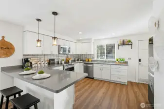 Stainless steel appliances and double ovens make hosting a breeze.