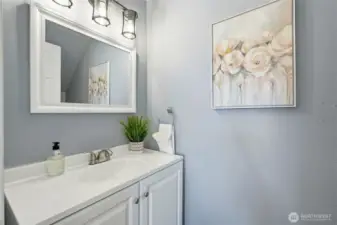 Convenient main-level half bath for guests.  Updated finishes give it a clean, modern feel.