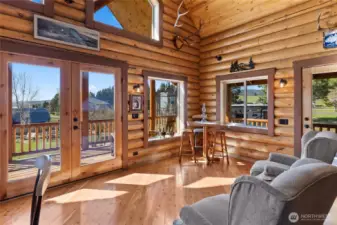 Another view of the living room. You have glass French doors on each side of the living room for easy outdoor access and lots of sunshine to enjoy.