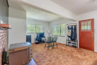 When you step inside, it feels a bit like a time capsule. The carpet that Grandpa chose all those years ago is still in good condition, holding onto the history of the home. The pellet stove stands ready as a focal point in the room, though it hasn’t been used in years and may need some attention before it comes back to life.