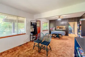 A classic touch from the home’s era, the dining area includes a pass-through window to the kitchen. It adds convenience for serving and a sense of connection between the spaces, while also reflecting the character of the home’s original design.