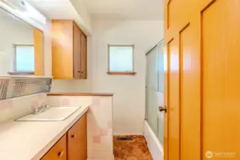 This full bathroom brings all the retro charm, right down to the original pink tile. It’s fully functional as it is, with plenty of room to refresh if you decide to update. Whether you lean into the vintage vibe or plan a full makeover, it’s a space with personality and potential.