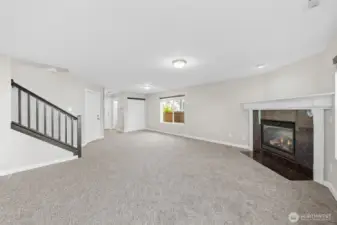 Cozy gas fireplace, closet and half bathroom off the entry.