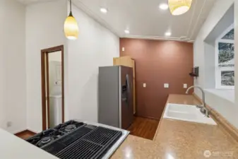 Kitchen view one, included newer propane stove and refrigerator.