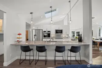 Entertain in style with a welcoming eat-up bar and lake views.