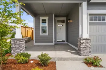Large, covered front porch, perfect for welcoming guests.