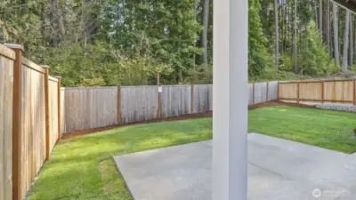 Similar, not actual. Back-yards professionally landscaped & fully fenced with 6’ cedar privacy fencing. This home features a serene, natural backdrop.