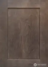 Charcoal-stain Shaker style Maple cabinets throughout.