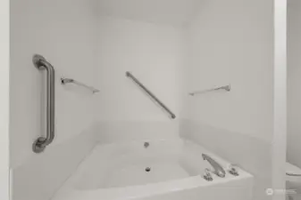 Primary bathroom with oval shaped bathtub. Future conversion to a shower?