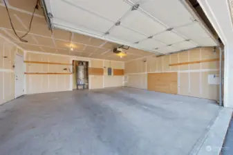 This garage is huge! Public records state 468 Sq Ft! The 50 gallon gas hot water heater and 2 gallon thermal expansion tank were installed on 3/2024. The door leads to the outside next to the front door.