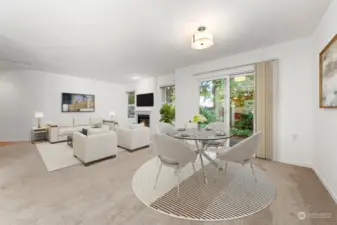 From the Kitchen, looking towards the rear yard. The dining area can easily seat 6+ people.   (Virtual Staging)