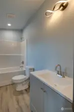 Bathroom features tub/shower combo.