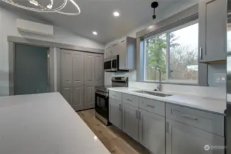 Gorgeous quartz countertops and beautiful cabinetry.