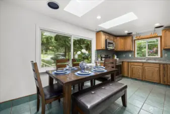 Eat in dining area is just off the mudroom and full height storage attic.