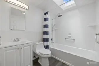 Mainfloor bathroom with natural light from skylight and fresh remodel.