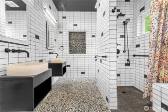 Custom en suite bathroom with dual sinks and a Roman shower. You've gotta see this!