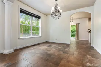 Stepping out of the kitchen, you'll find a formal dining space bathed in natural light.